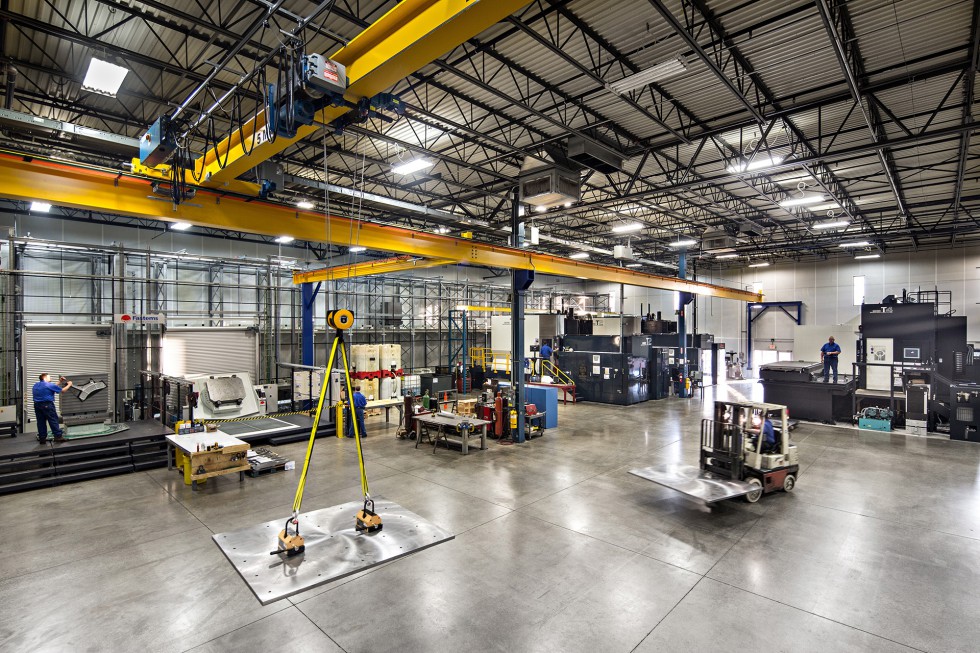 A wide shot of the Patriot Machine shop floor, showing the installation of a new machining center.