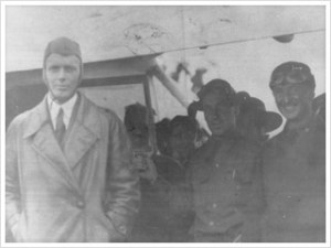 An old, black and white photograph of an aviation squadron, featuring Charles Lindbergh and David S. Kemp, Judy Burns' grandfather.